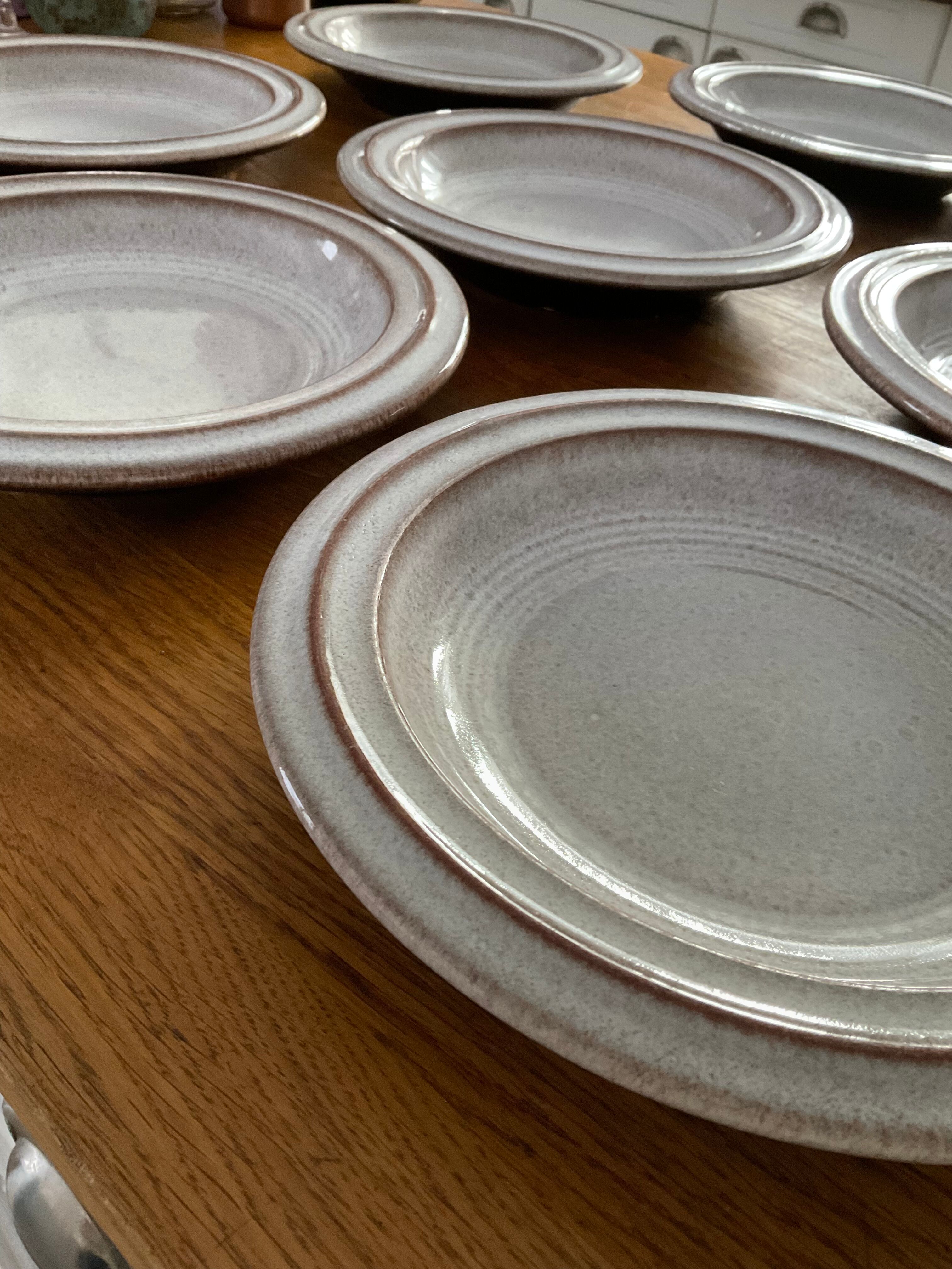 8 hollow plates in glazed terracotta