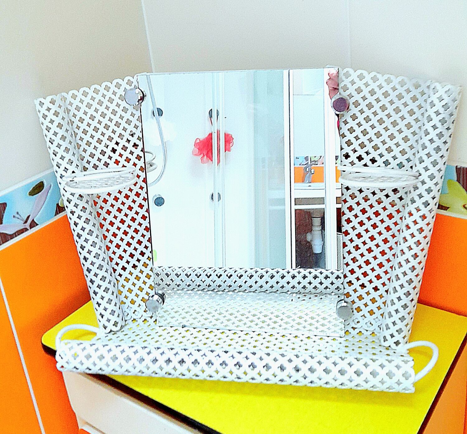 Perforated sheet metal bathroom shelf