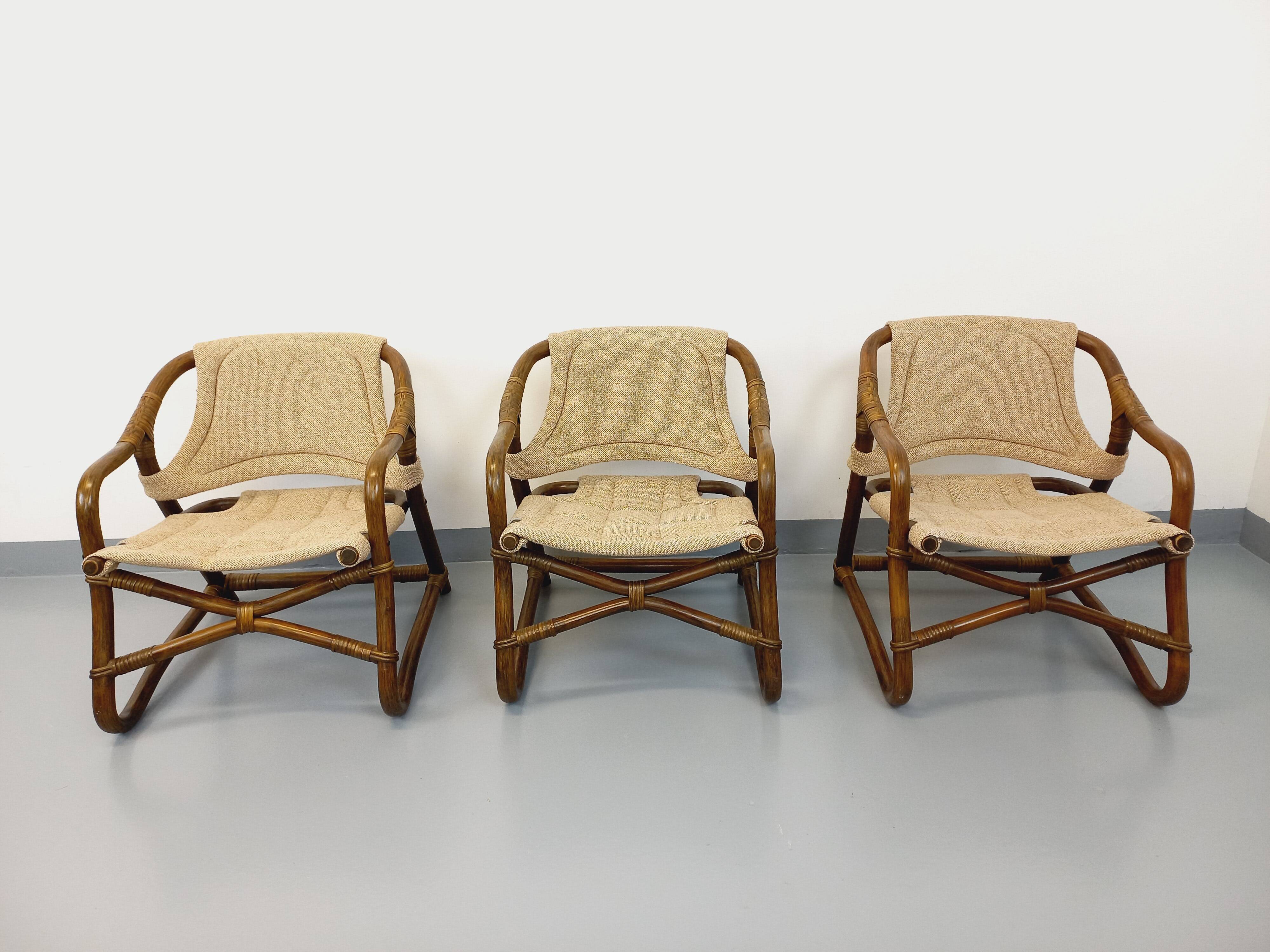 Set of 3 vintage Danish safari-style armchairs from Horsnæs Møbelfabrik in rattan and fabric from the 1980s.