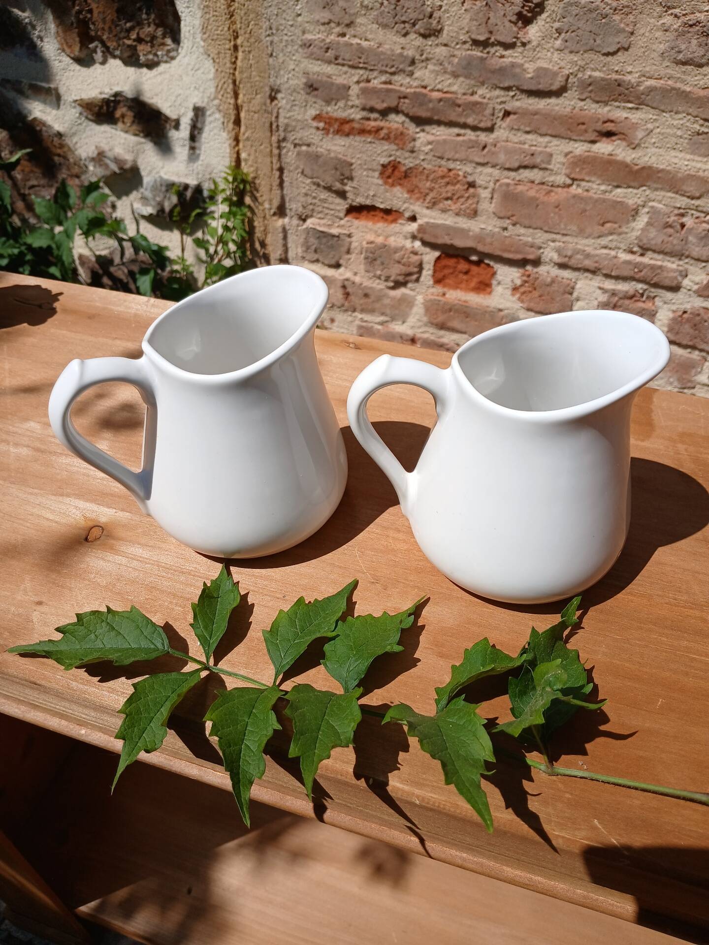 2 vintage milk jugs