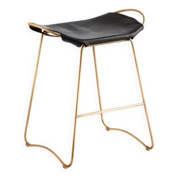 Contemporary organic kitchen bar stool in brass metal and black leather.