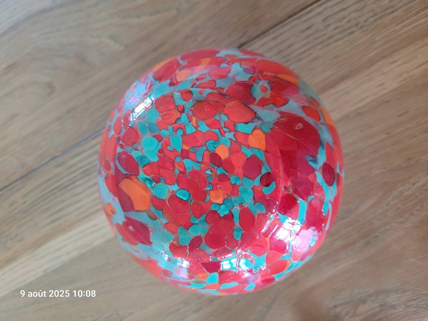 Old multicolored glass flower vase