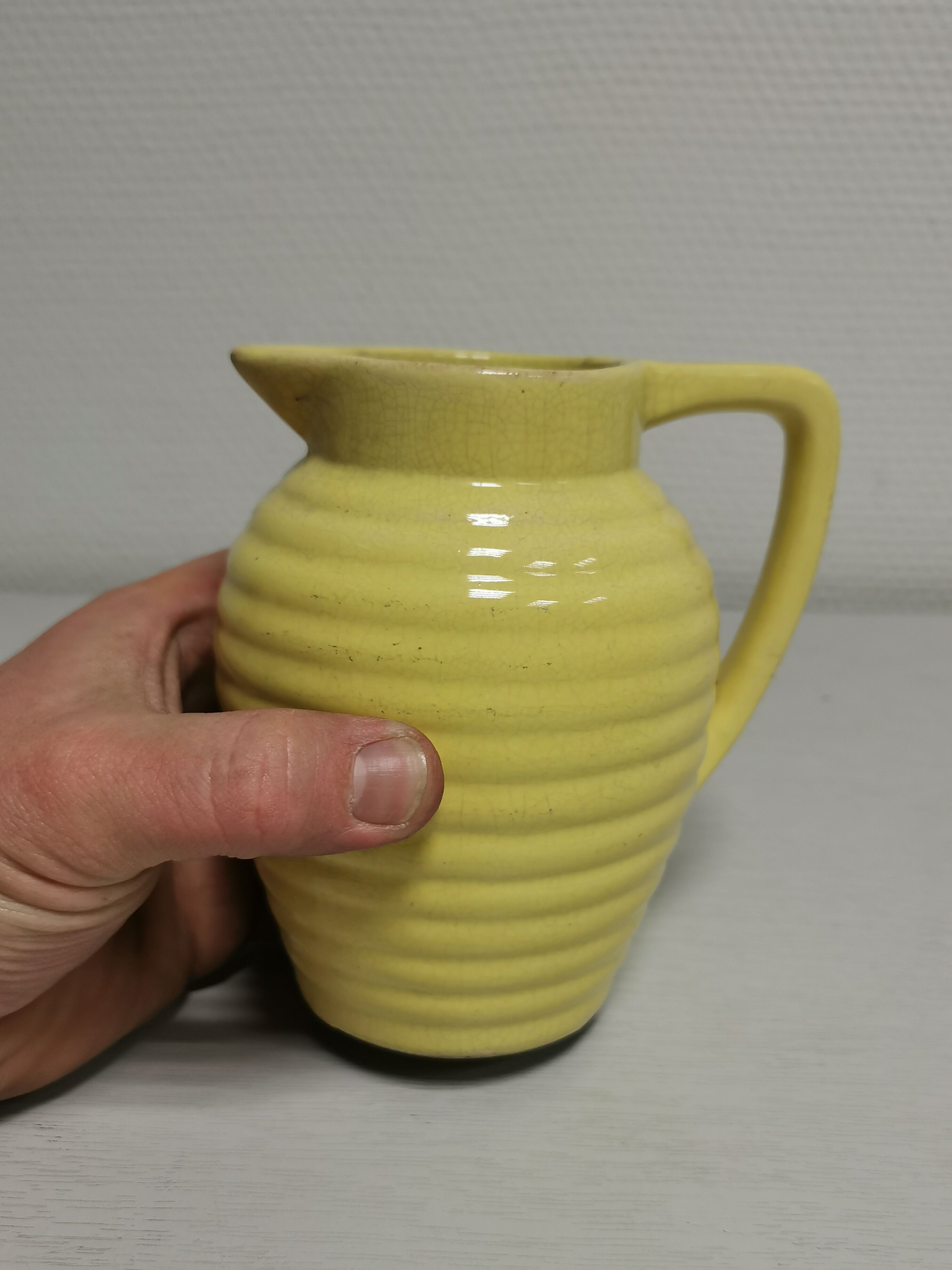 Yellow pitcher in slurry, faience onnaing frères
