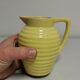 Yellow pitcher in slurry, faience onnaing frères