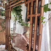 Large sculptural mirror handmade from natural bamboo and woven rattan, 1960.