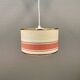 Hanging lamp with brass-coloured details, made of fabric with intact plastic bottom grille.