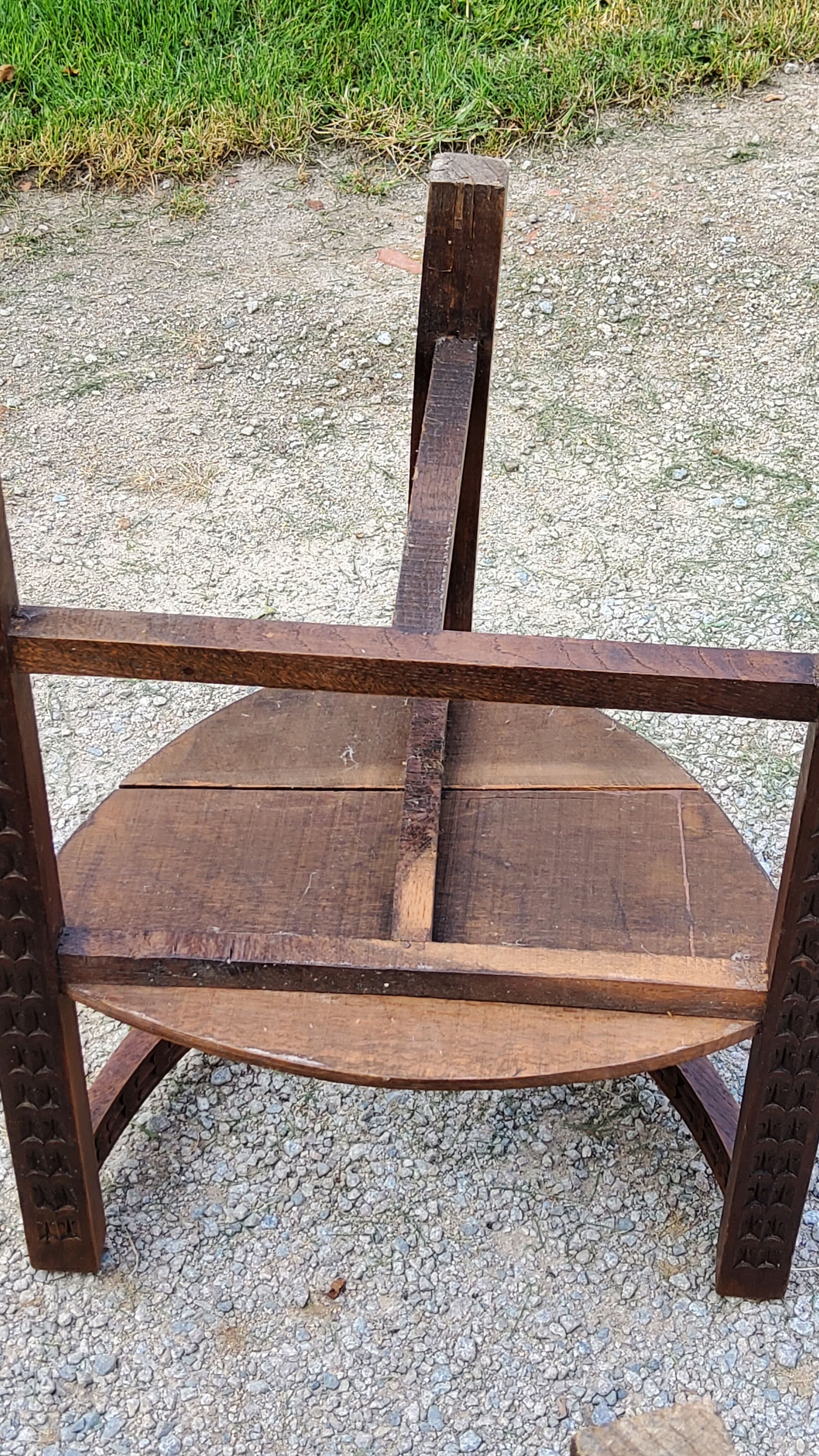 Set of three brutalist tripod armchairs in carved solid oak