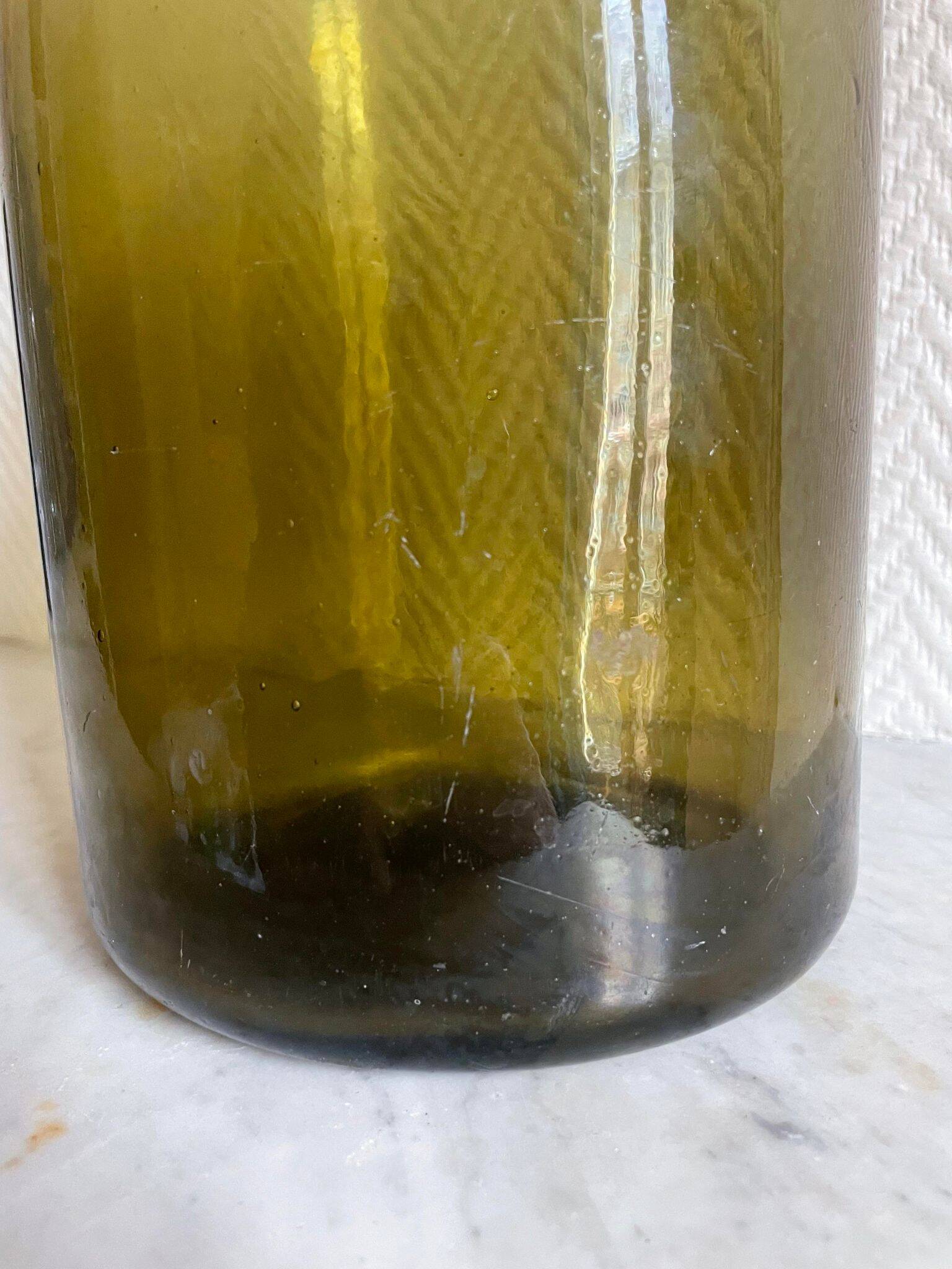 Large green blown glass vase