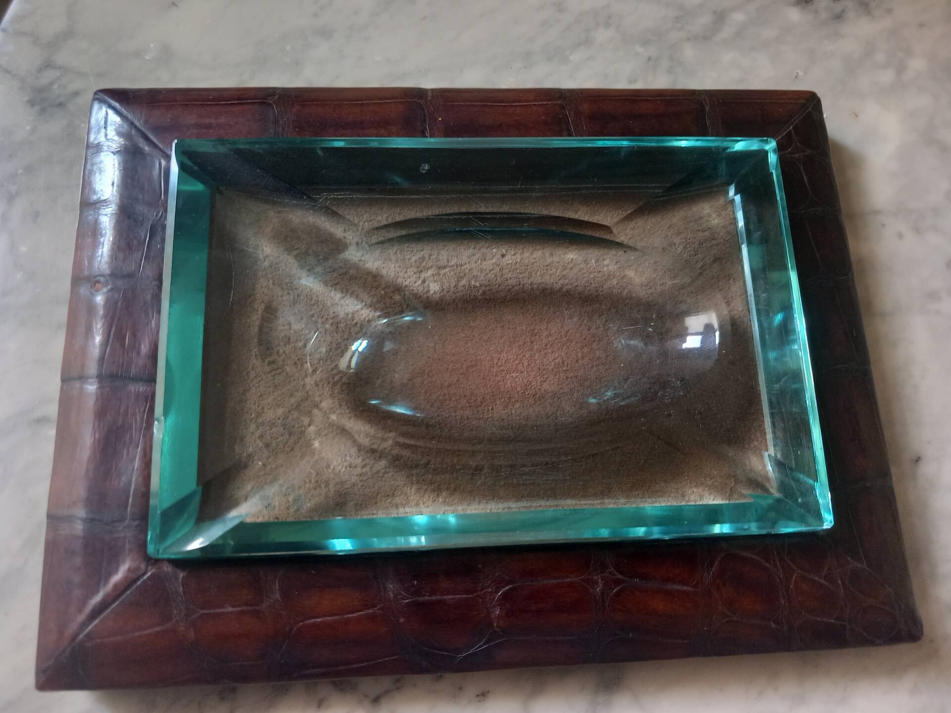 Crocodile leather ashtray with cut crystal.