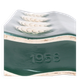 A tall ceramic vase glazed with dark green colour