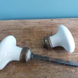 White porcelain door knob handles