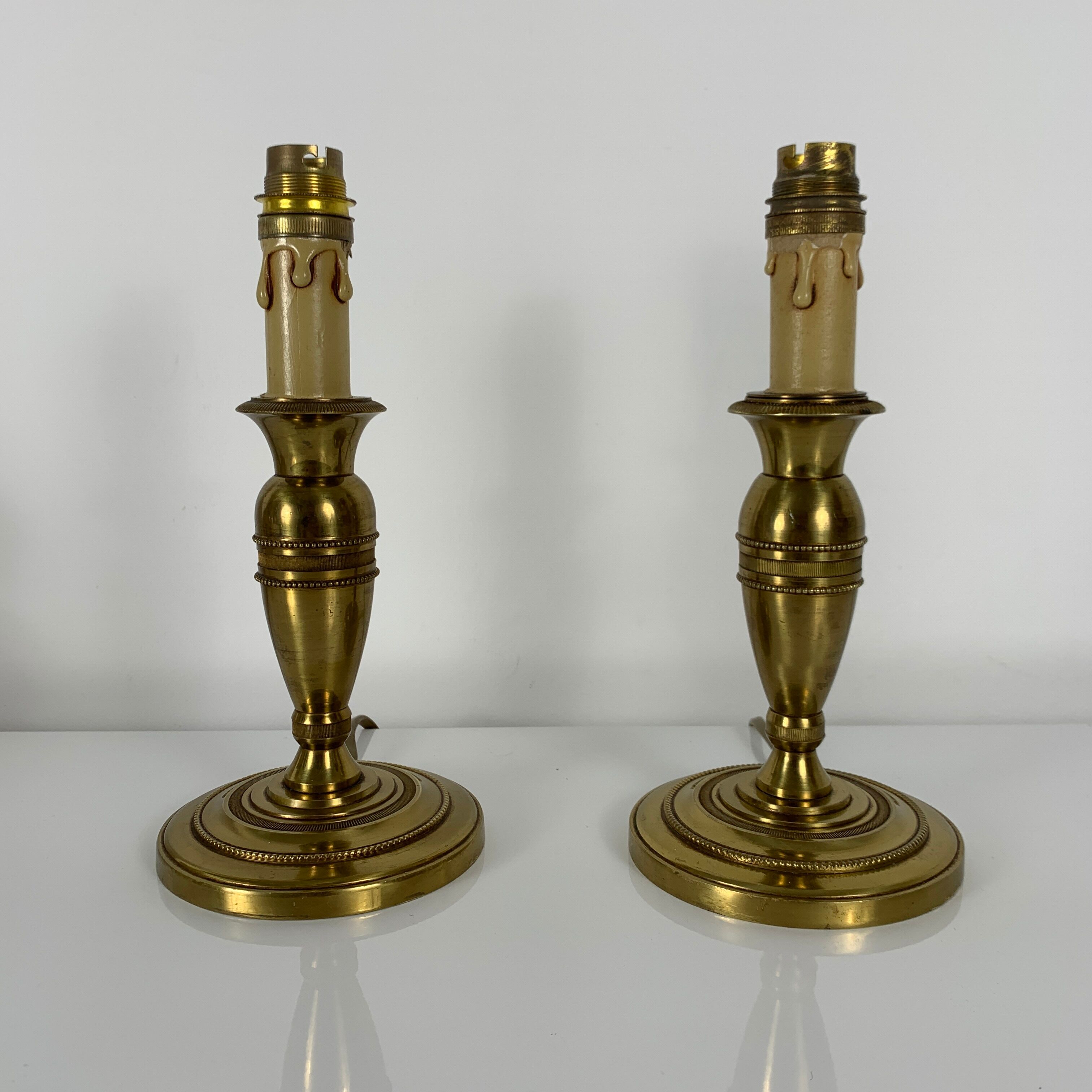 Pair of gilded bronze candlestick lamps gossip style French Empire