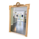 large antique mirror with richly carved pediment in Louis XV / Napoleon style