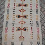 White kilim carpet with multicolored Berber patterns