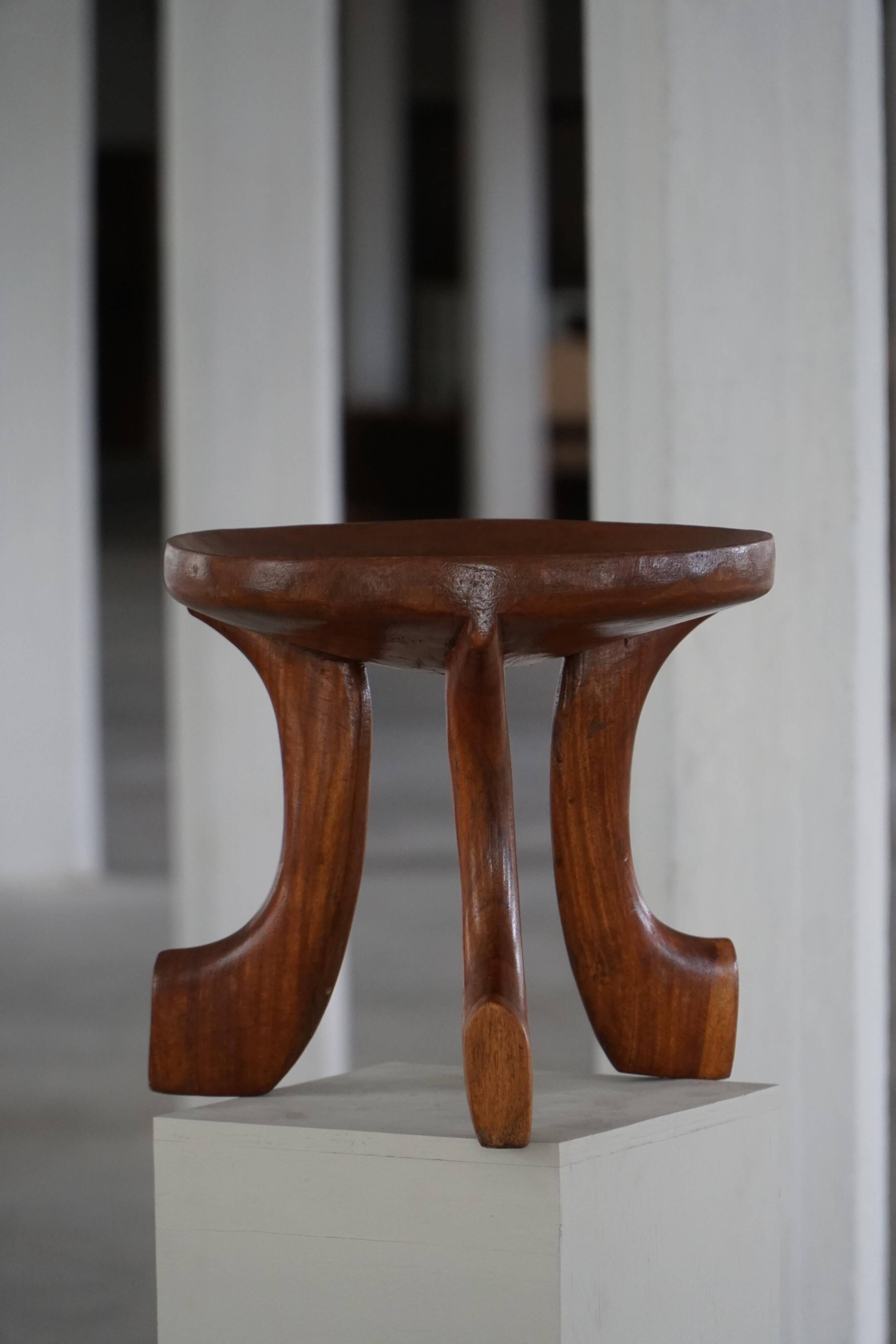 Oromo stool from mid-20th century Africa, hand-carved wood, tribal style.