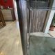 Vintage 1950s silver metal bar cart with wheels and two glass shelves