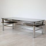 Chrome metal coffee table with smoked glass top.