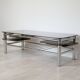 Chrome metal coffee table with smoked glass top.
