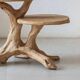 Rustic sculptural side table made of natural and organic driftwood.