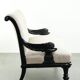 French sofa from the 19th century in Empire style with detailed armrests