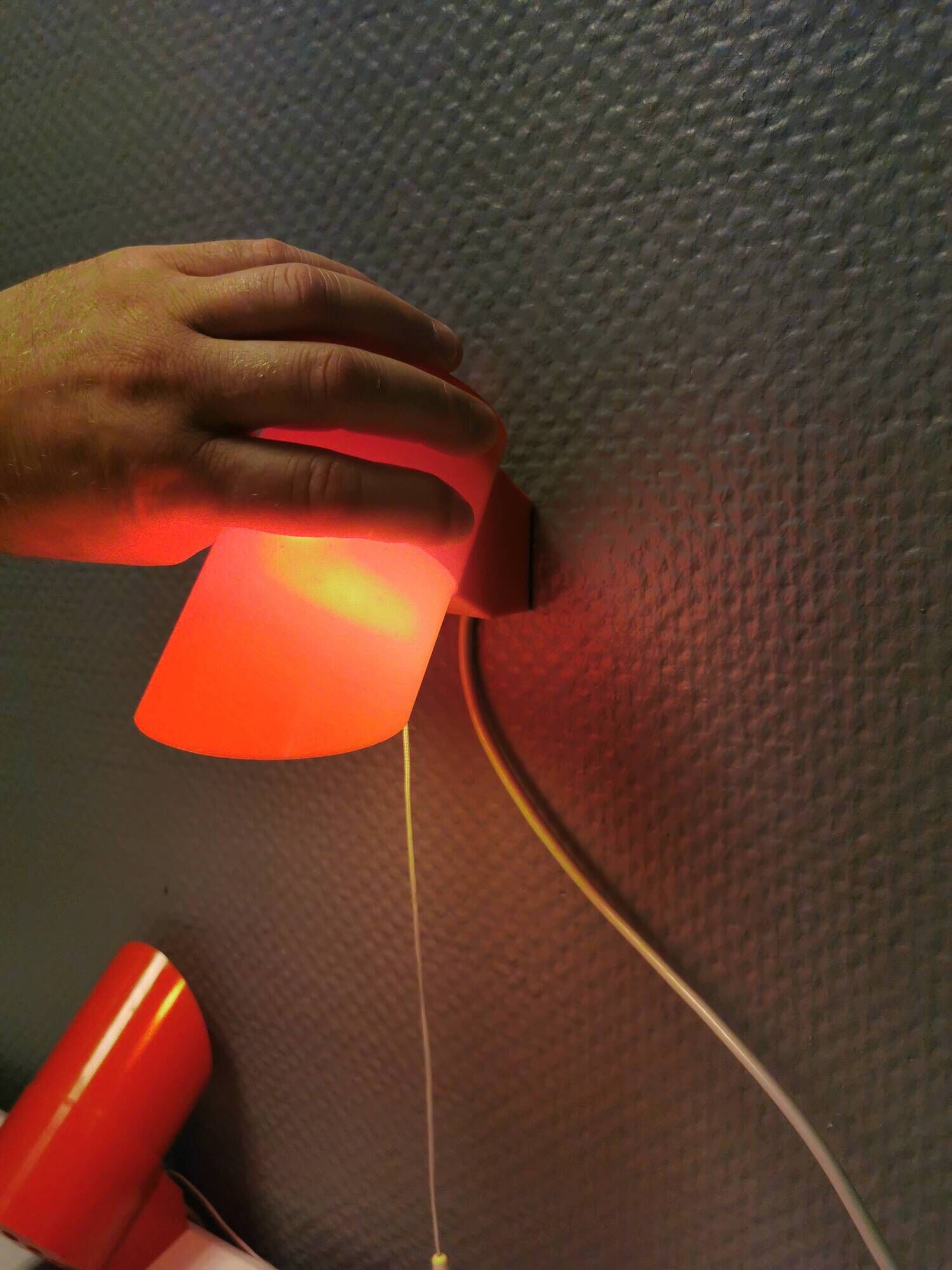 A set of "Nathue" wall lamps (meaning night cap) in a retro red colour, 1970s Denmark.