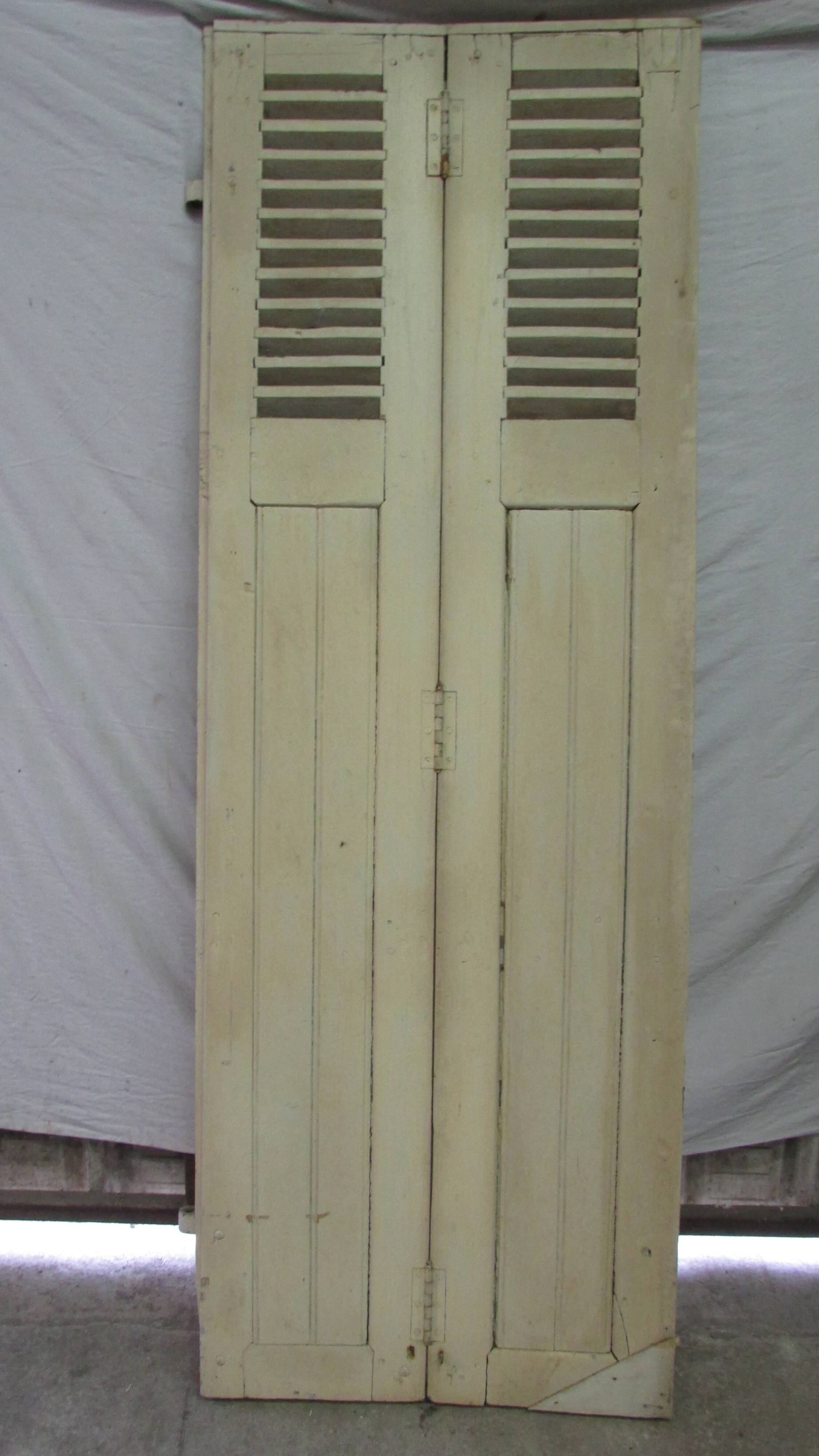 Old shutter in folding wooden louver