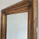 Antique giltwood wall mirror in gold