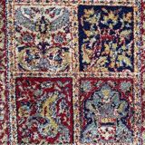 Vintage mechanical Turkish rug with box decoration on a red and navy blue background 139 x 68 cm