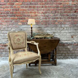 Fauteuil français avec tapisserie florale