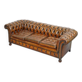 Restored vintage leather Chesterfield canapé in Thomas Chippendale style.