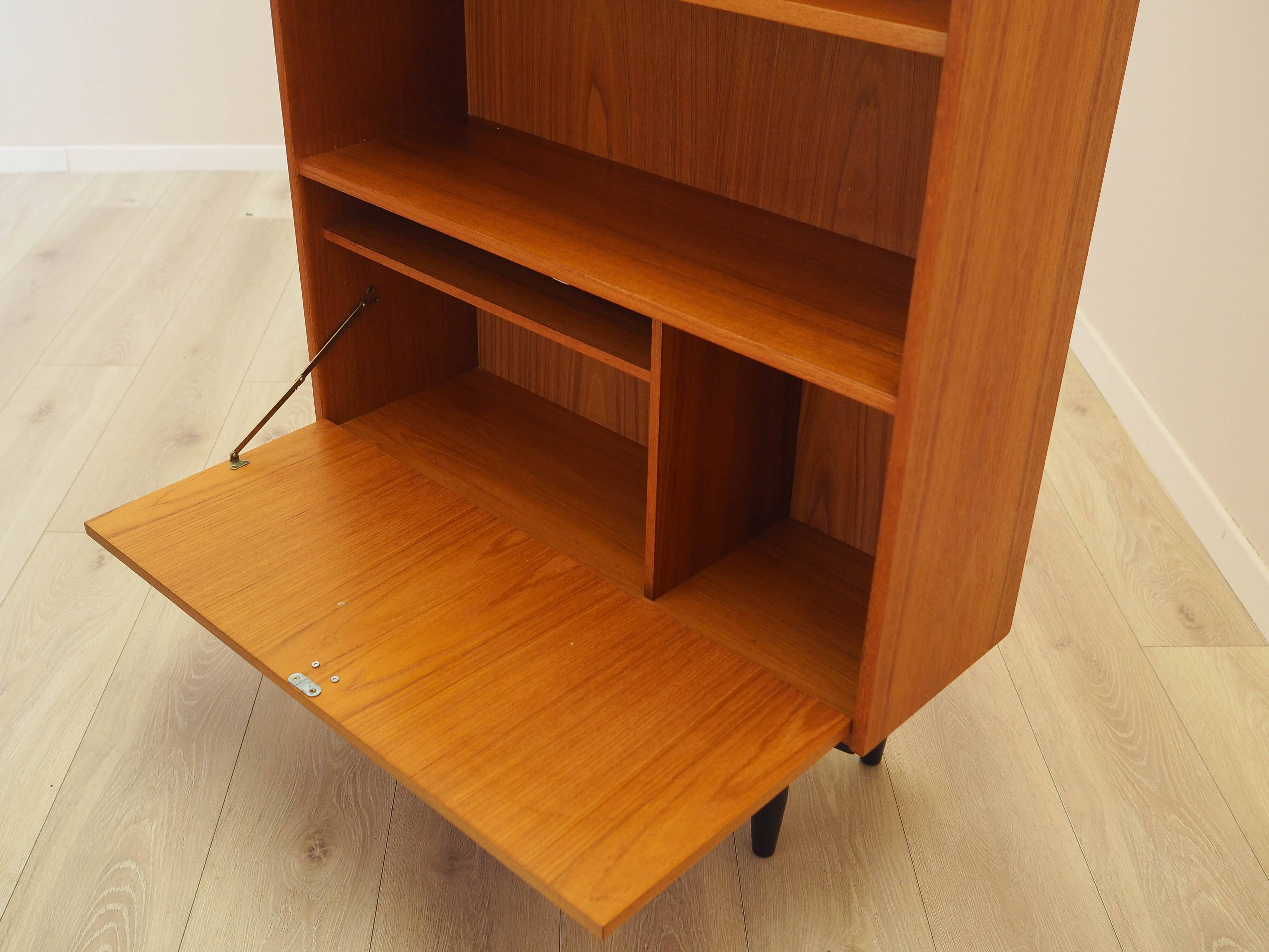 Danish teak-veneered bookcase with a bar and adjustable shelves, 1970s.