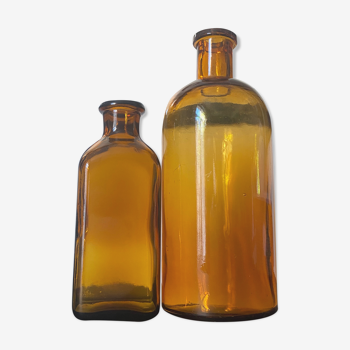 Duo of amber glass bottles
