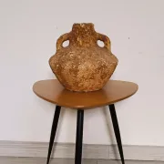 Textured terracotta vase in wabi-sabi style