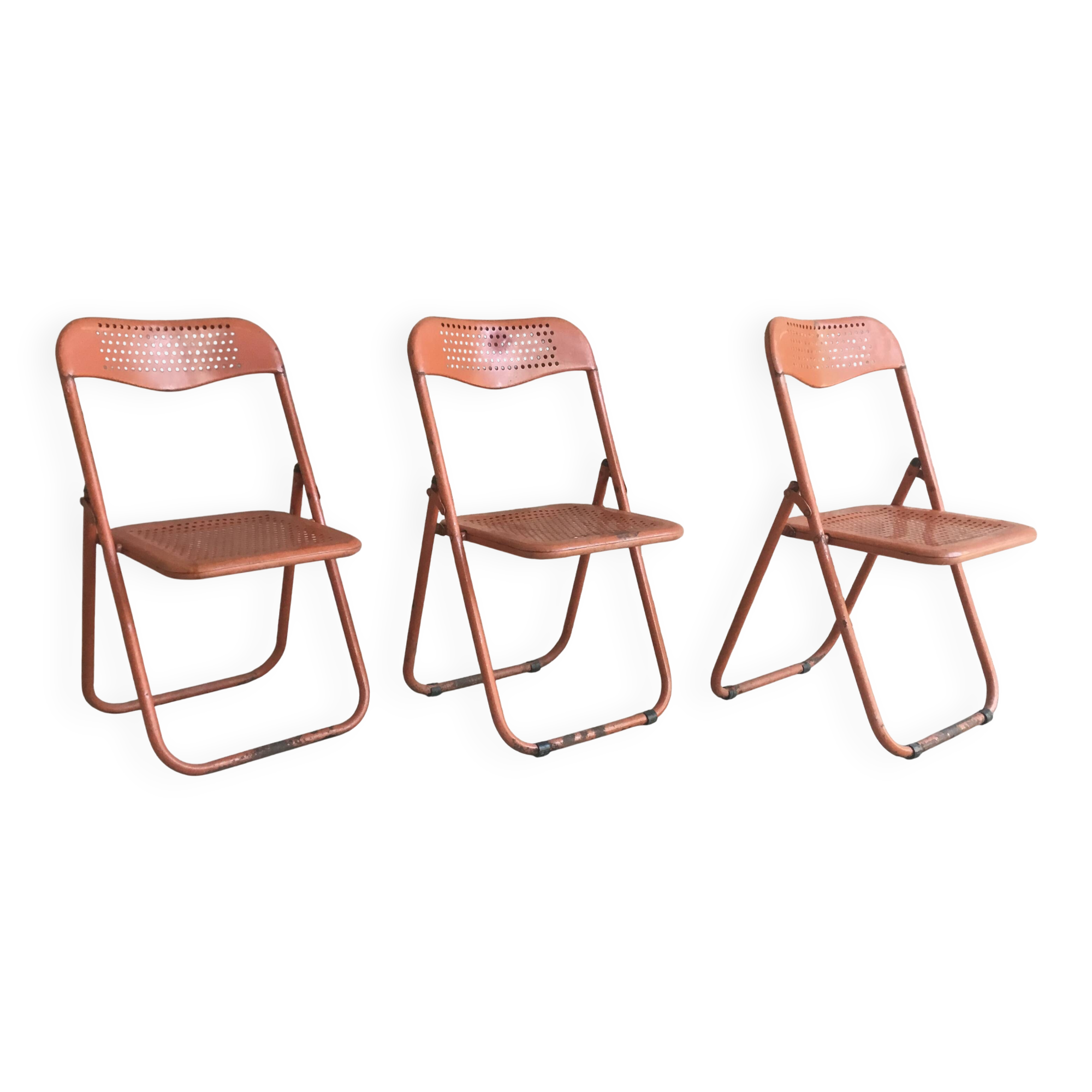 Trio of orange metal folding chairs - vintage