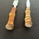 Bamboo handle cheese knives.