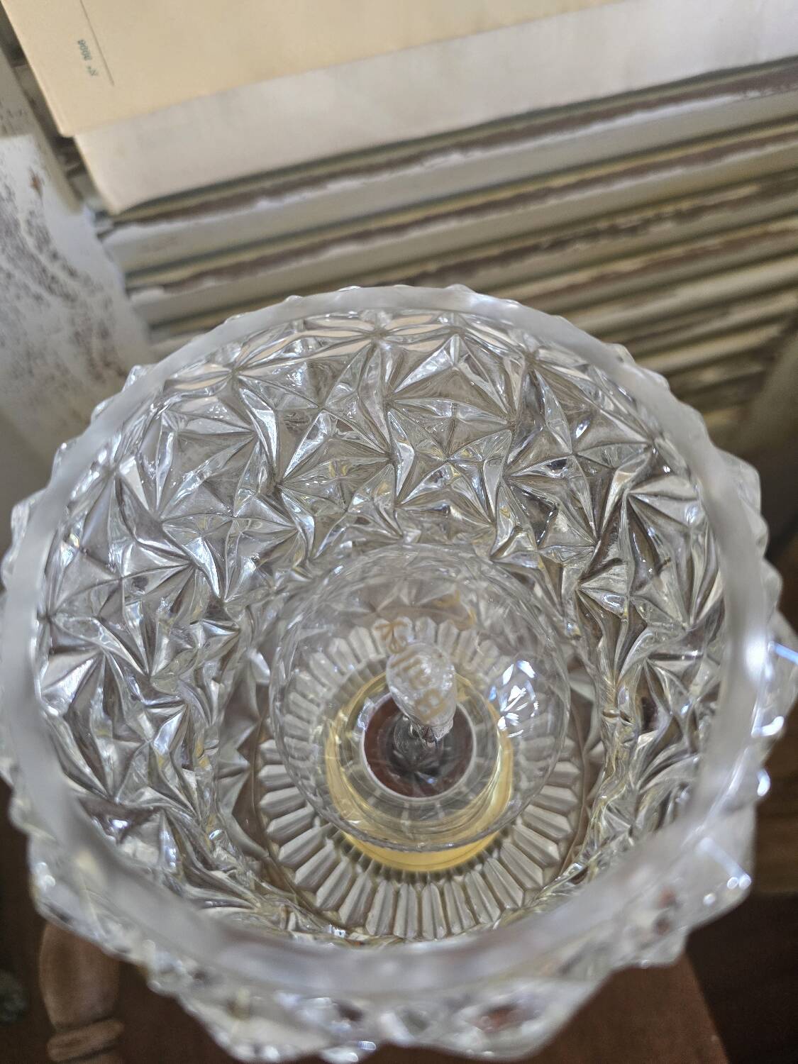 Vintage table lamp with a bronze base and moulded glass globe.