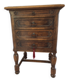 Four-drawer sculpted solid oak chest of drawers in Neo-Tudor English style, 1930.