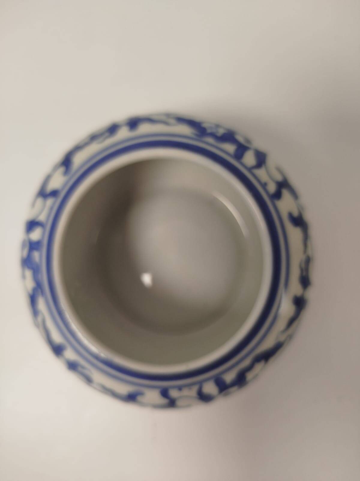 Small round Chinese-style porcelain pot with blue and white decoration
