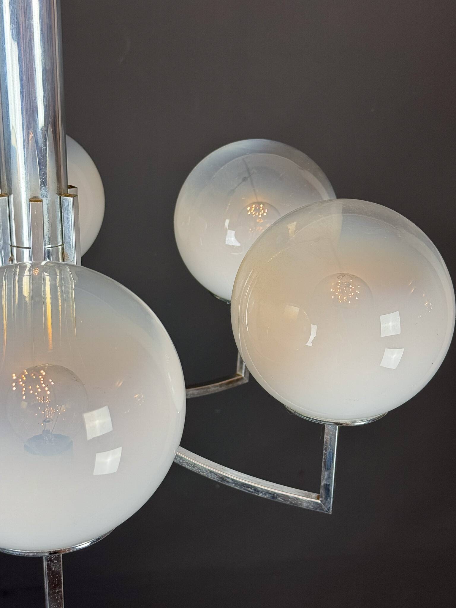 Six arms chandelier in murano glass spheres and chrome. Italy 1960s