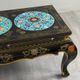 Black lacquered wooden coffee table with cloisonné and polychrome decoration, 20th century.