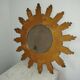 Miroir soleil bois sculpté doré