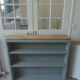 Vintage shallow bookcase, re-enchanted in gray green, wooden tray.