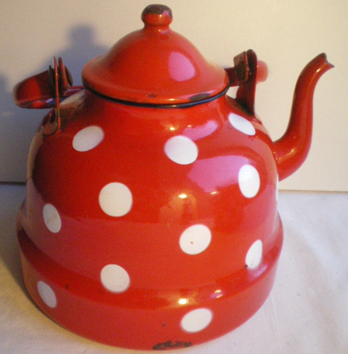 Vintage kettle in red enamelled sheet with white polka dots