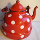 Vintage kettle in red enamelled sheet with white polka dots