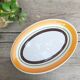 Orange and brown oval dish