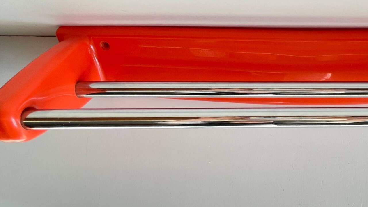 Orange towel rack by Syla from the 70s