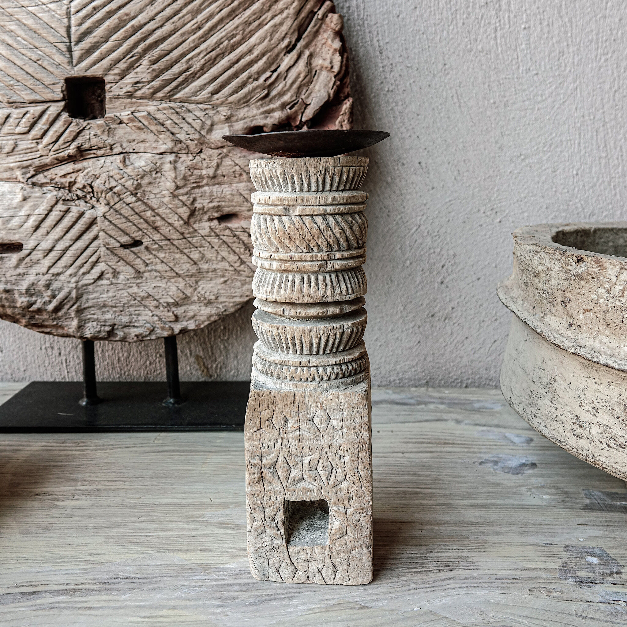 Candle holder in light carved wood