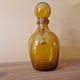 Biot perfume bottle or bubbled glass bottle in amber colour, 1970s design.