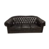 Three-seater black leather chesterfield sofa