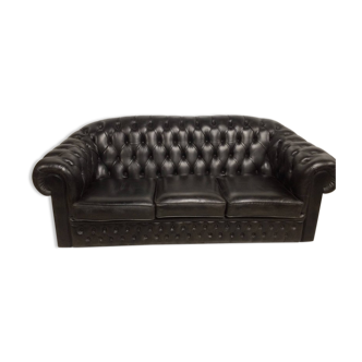 Three-seater black leather chesterfield sofa